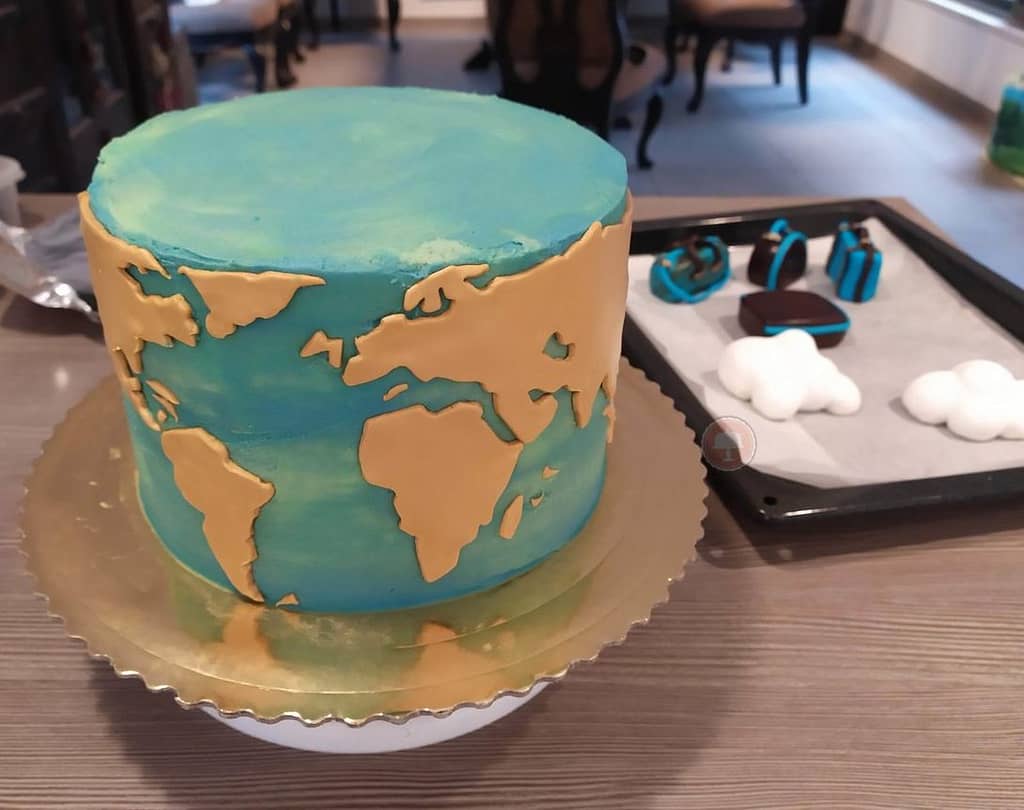 Fun And Creative Travel Cake With Map And Luggage Toppers