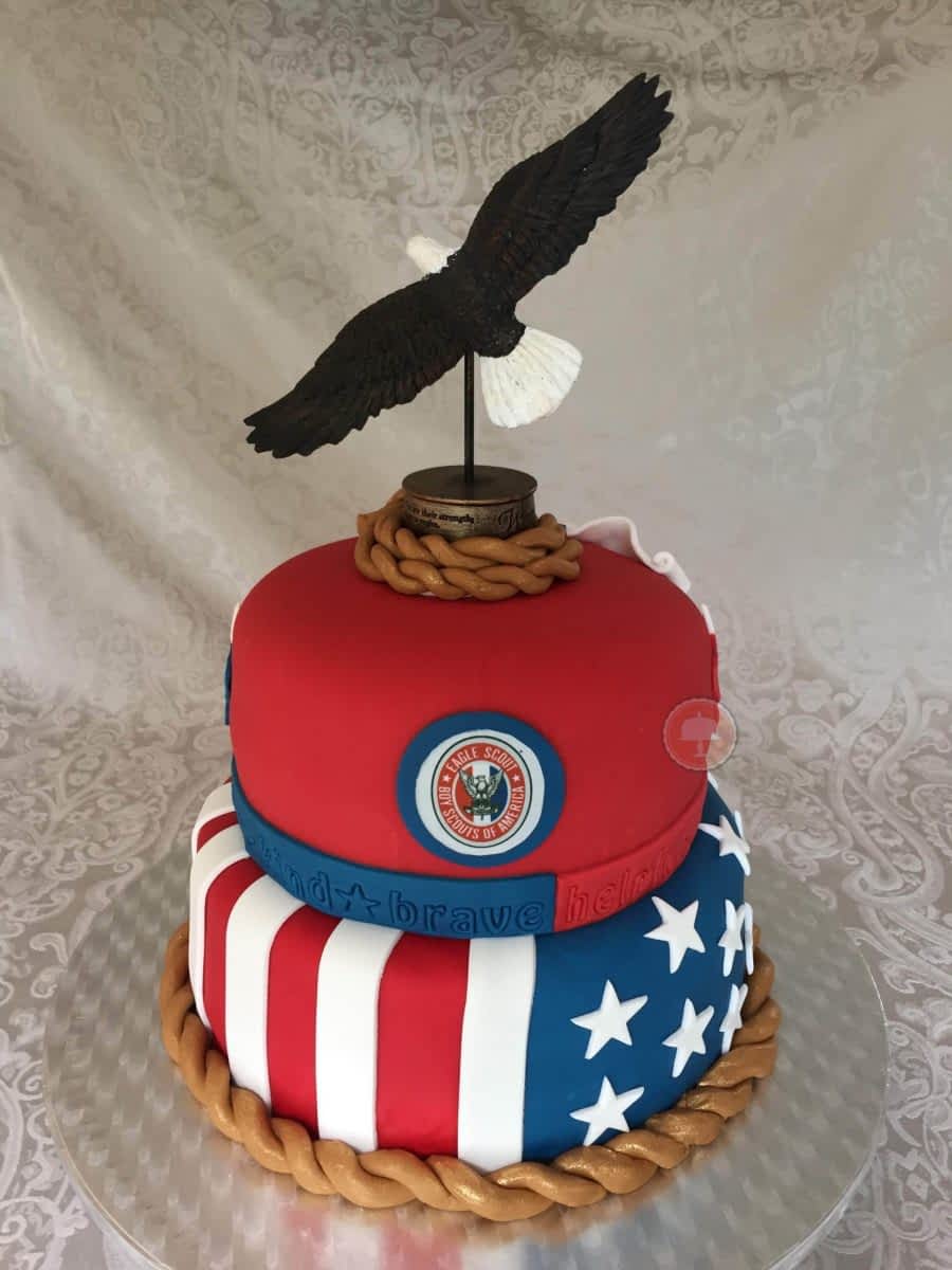 eagle scout cake red white and blue with fondant and eagle on top two tier