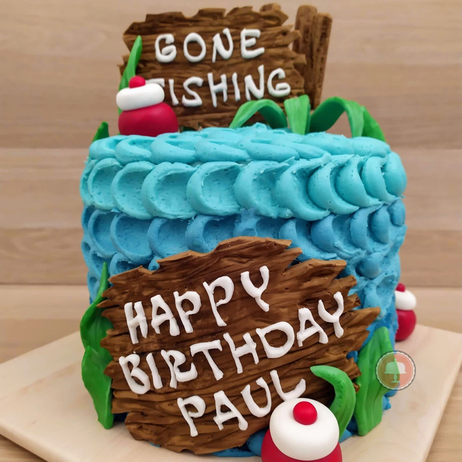 fishing cake with buttercream and gone fishing