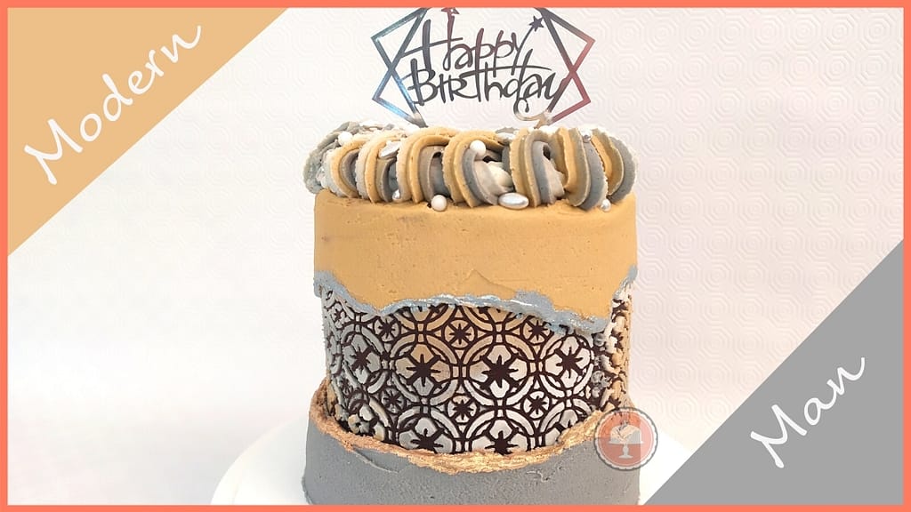 this birthday cake for men is an example of a cake design for men which has a fault line design with a rich pattern revealed behind the fault line, the colors are masculine and has a sliver cake topper Happy Birthday on top
