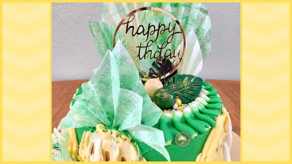 5 Steps to a Surprisingly Simple Festive Pineapple Cake Design 4 pineapple cake design with lime buttercream wafer paper fans and leaves candy melt chocolate molds edible luster dust