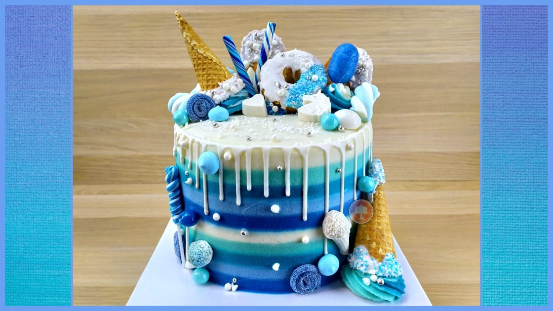 blue candy striped drip cake with chocolate candy molds