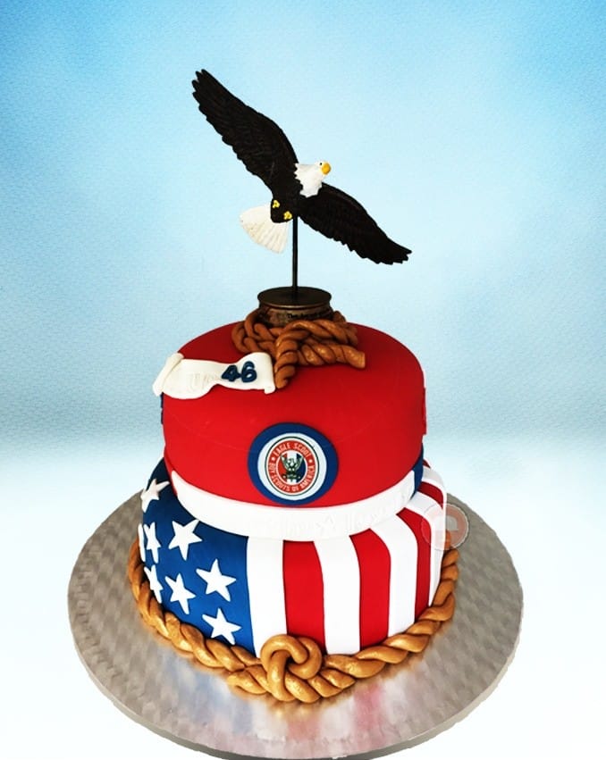 eagle scout cake red white and blue with fondant and eagle on top two tier