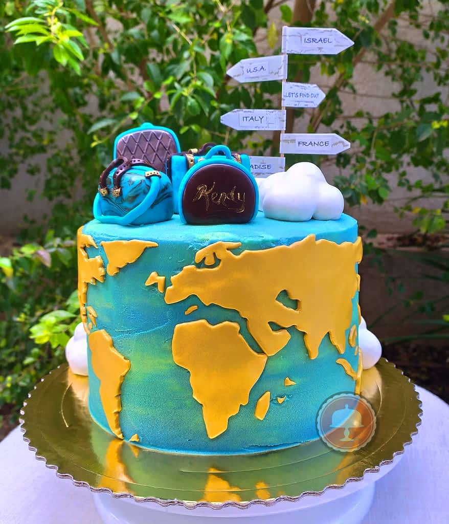 travel cake with map outdoors, luggage cake toppers  made of fondant, perfect world map cake for birthday.