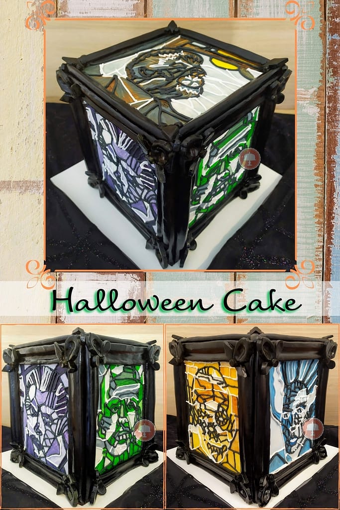 Halloween cake sitting on a party table showing the universal monsters.  Cake is made using a stained glass piping technique.  