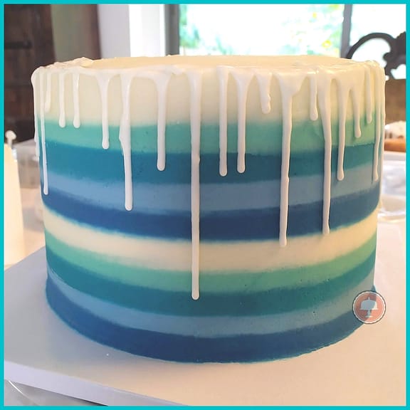 buttercream striped cake white chocolate drip blue teal white 