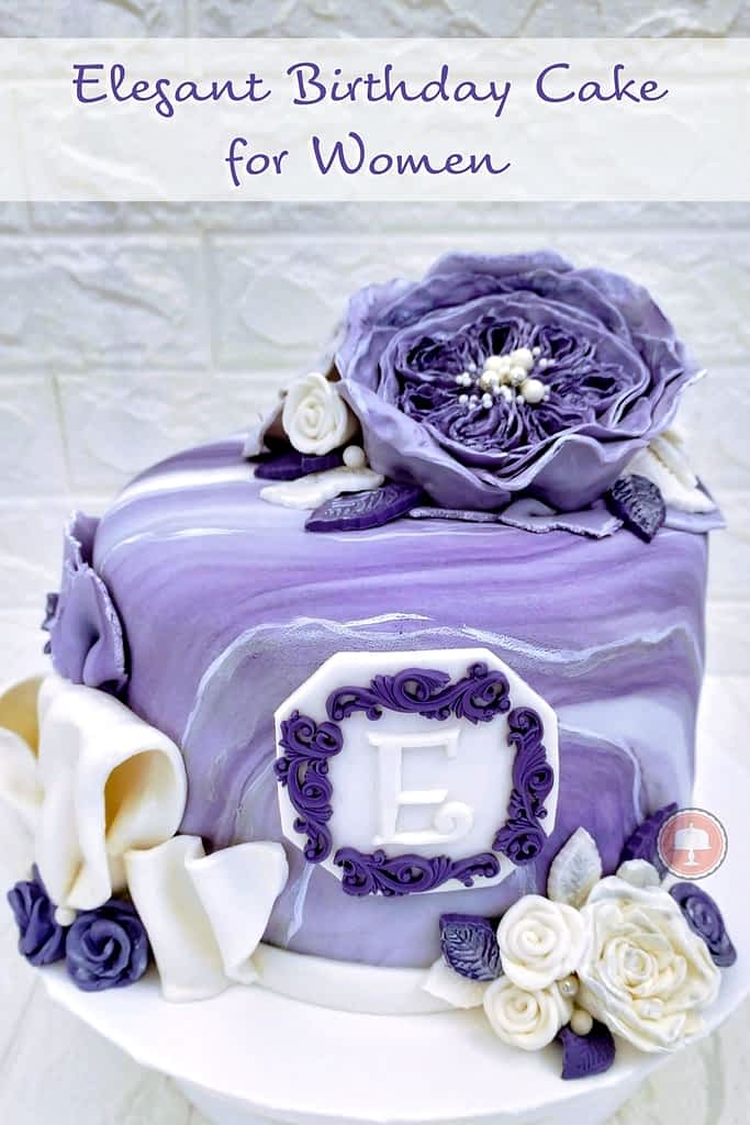 This Elegant Birthday Cake for women is shown with fondant flowers with a marble effect.