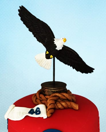 eagle scout cake topper on top of cake
